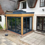 Aluminium Bifolds and korniche roof lantern