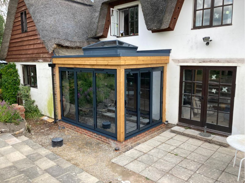 Aluminium Bifolds and korniche roof lantern